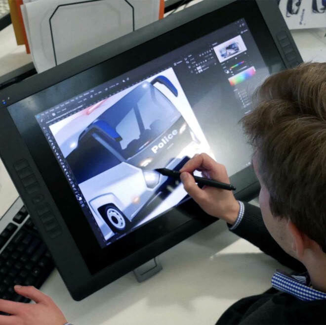 Cobalt designer sketching concept design for Victoria Police ADT3 bus on digital tablet