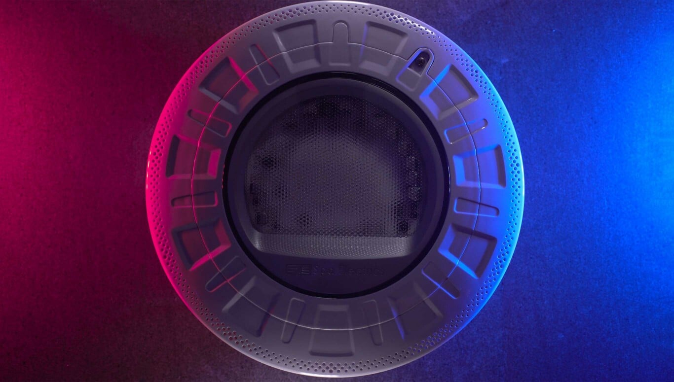 Spa Electrics Retro pool light turned off in dark environment with magenta and blue hue illuminating from the sides.