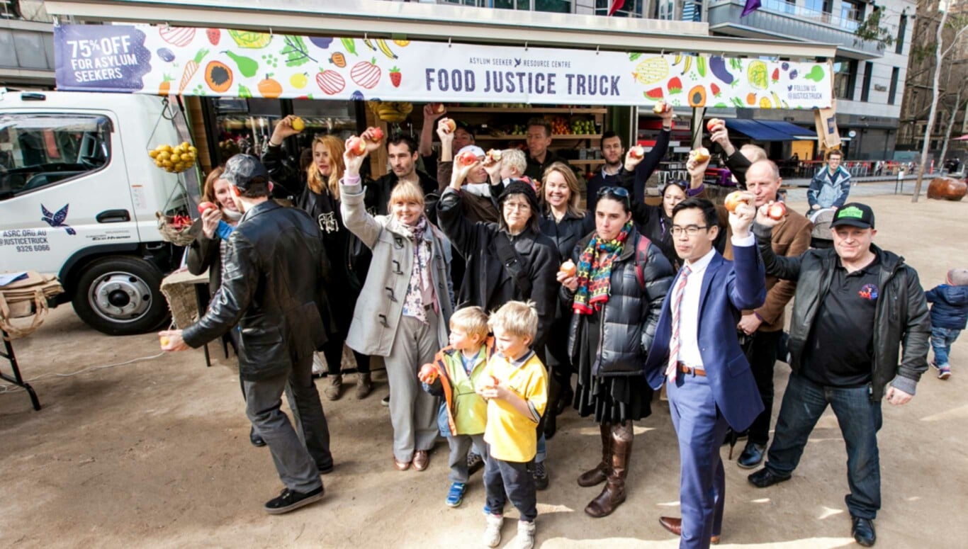 A gathering of people around a food truck